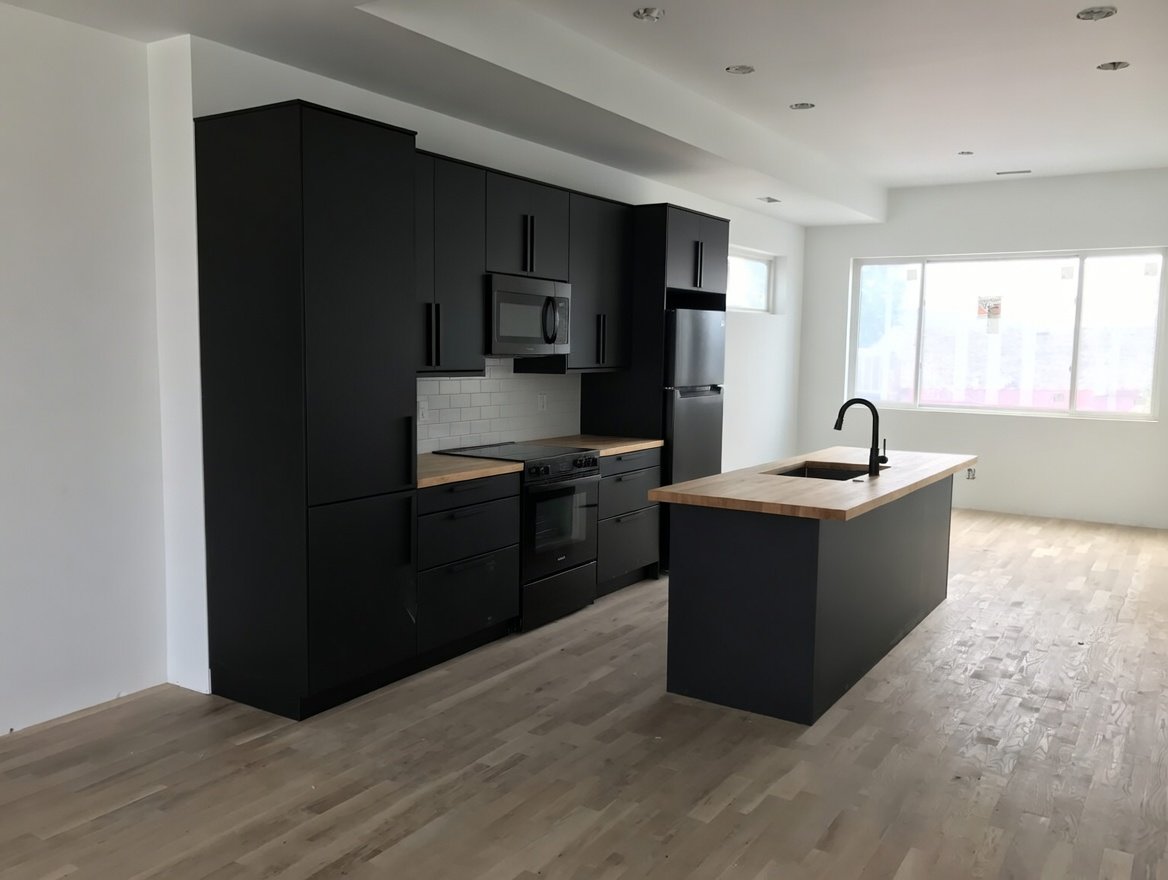 Black kitchen with custom counters